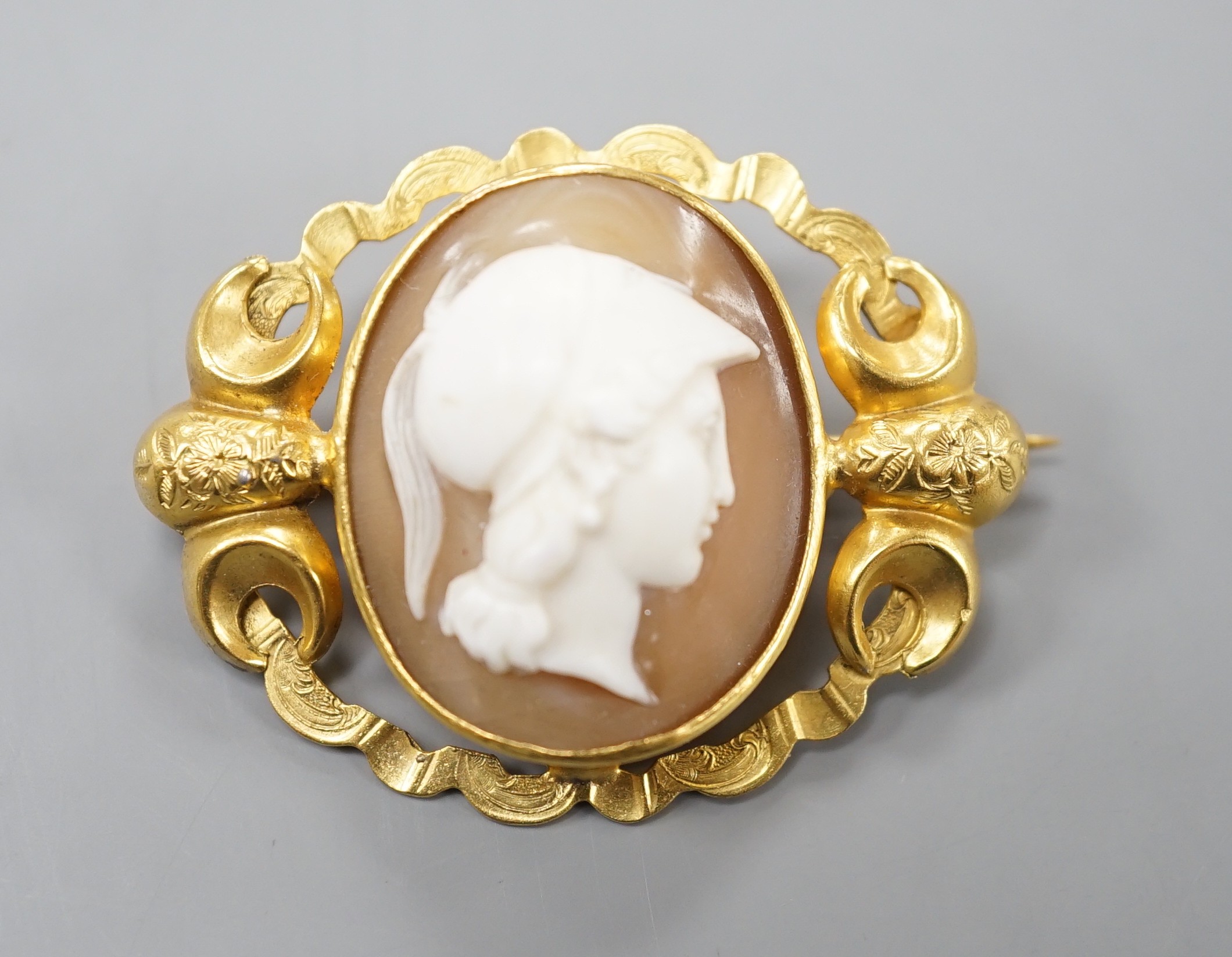 An early 20th century yellow metal mounted oval cameo shell brooch, carved with with the bust of a gentleman to sinister, 37mm, gross 7.6 grams.